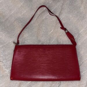 Red Louis Vuitton pochette. Pictures show wear but works perfect!